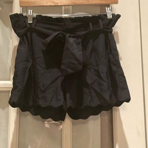 Ellie's Junior's black silky soft shorts size 4 with matching black belt